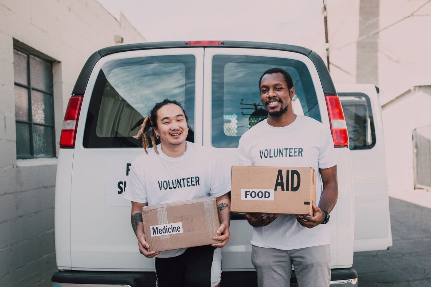 Together As One volunteers with food and medical aid